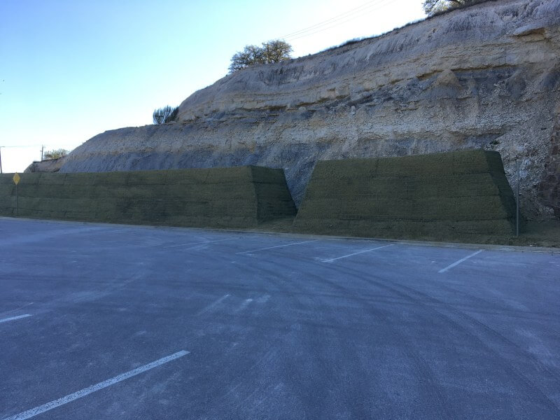 Parking lot protection with rockfall embankment